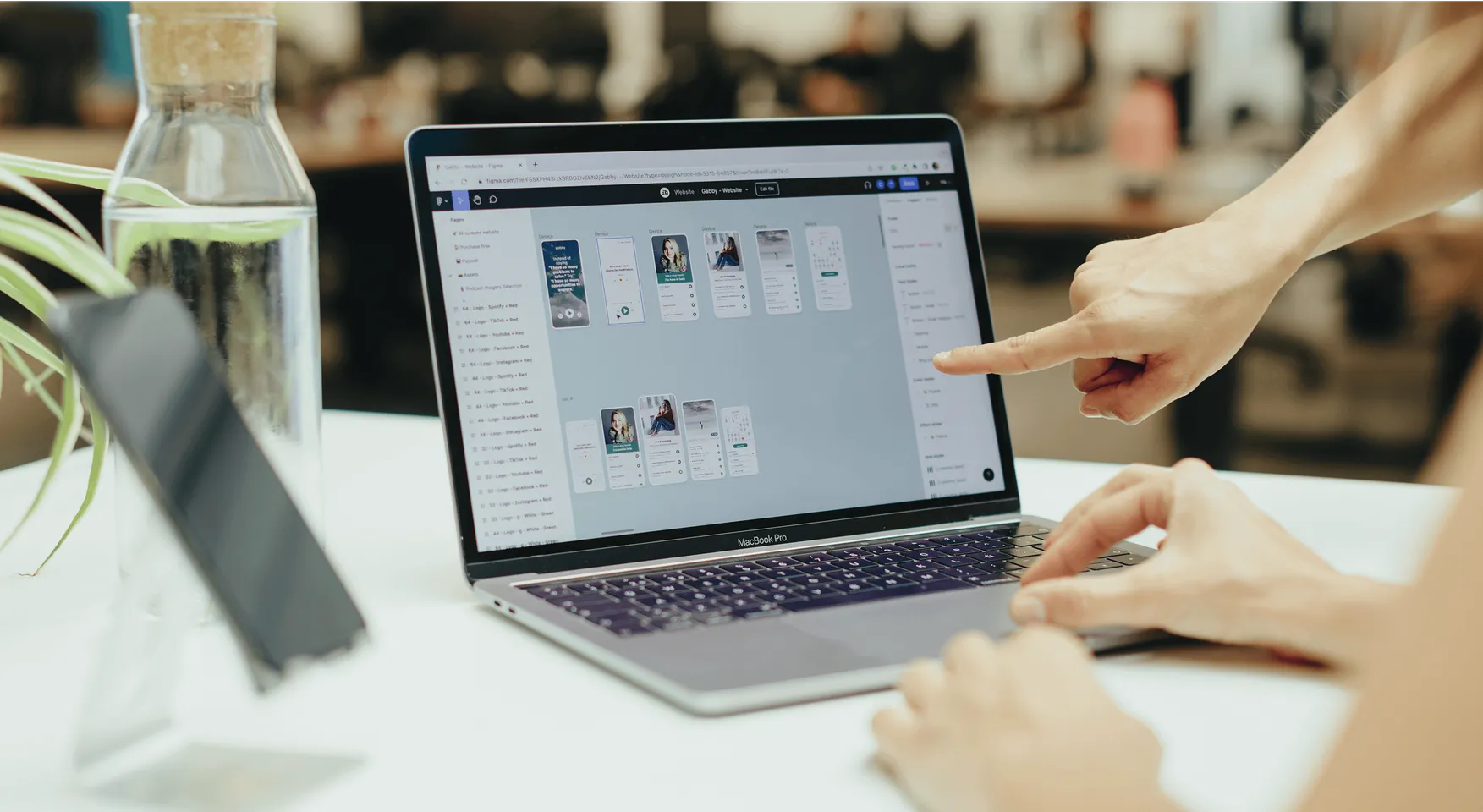 Photo of a desk with someone using the app in a phone